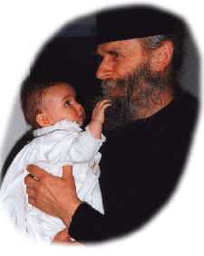 Fr. Cassien with infant